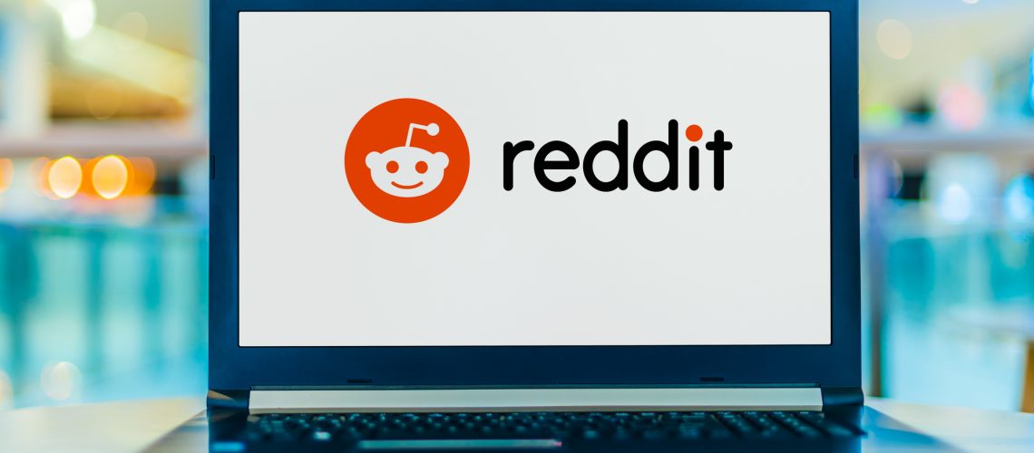 POZNAN, POL - JAN 30, 2020: Laptop computer displaying logo of Reddit, an American social news aggregation, web content rating, and discussion website