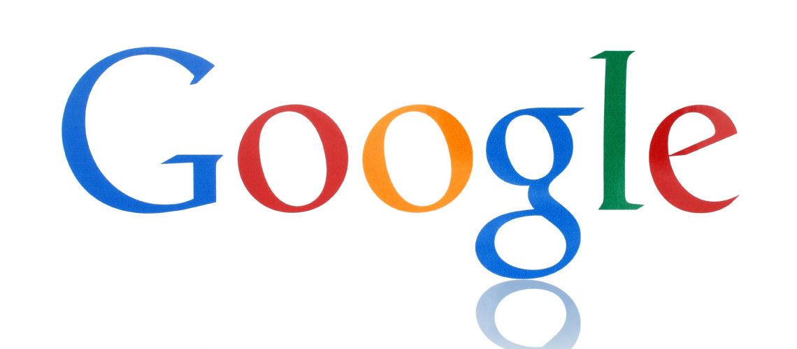 KIEV, UKRAINE - FEBRUARY 19, 2015:Google logotype printed on paper. Google is USA multinational corporation specializing in Internet-related services and products.